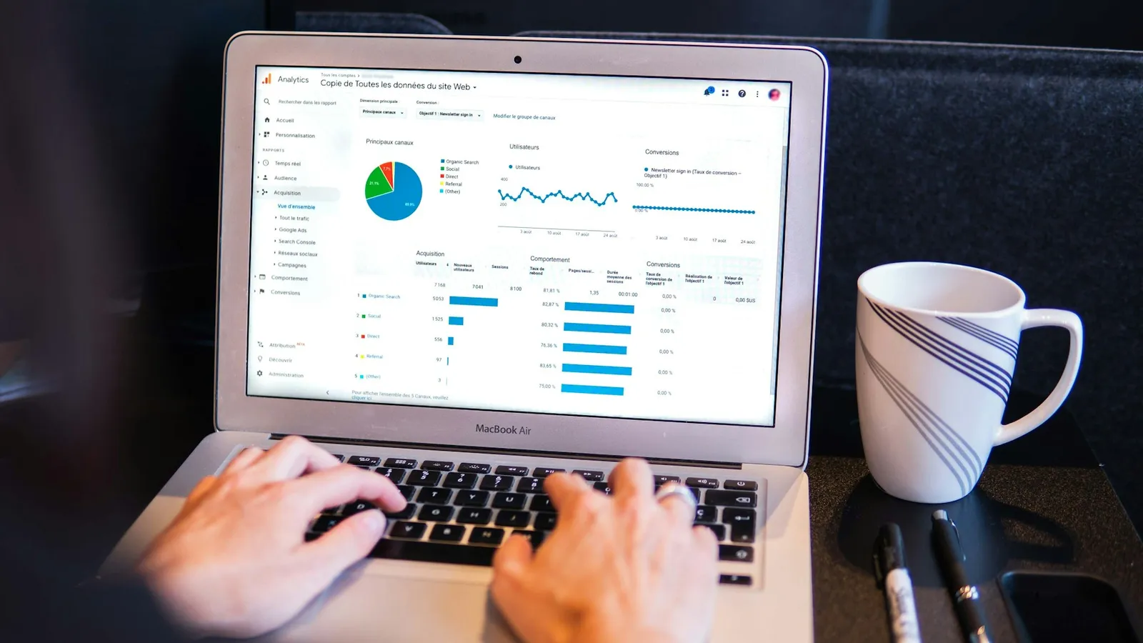Real estate CRM dashboard on a laptop showing pipeline and lead sources